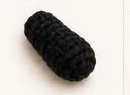 Lightly stuffed black crocheted panda arm, cylindrical with a tapered rounded tip