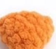 Small stuffed orange chenille beak piece with a rounded, wedge-like shape