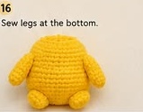 Yellow crocheted body with both legs sewn to the bottom front, standing upright