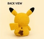 Finished Pikachu amigurumi viewed from the back, showing the tail placement